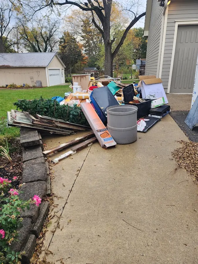 Dumpster being loaded with debris for Commercial Dumpster Rental in Orangetown
